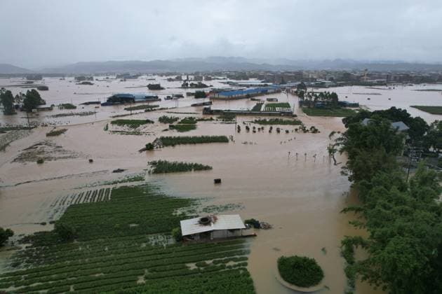 NANNING, CHINA - JULY 06: In an aerial view, floodwaters inundate Pingshan Village after local reservoirs overflowed due to Typhoon Maysak on July 6, 2026 in Hengzhou, Nanning, Guangxi Zhuang Autonomous Region of China. Local authorities are organizing the evacuation of residents in affected areas of Hengzhou City and Binyang County in Guangxi.  Copyright: xChinaxNewsxServicex 111652617414