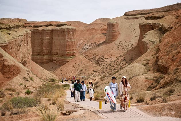 ZHANGYE, CHINA - JULY 06: Tourists visit Alien Valley Geopark on July 6, 2026 in Sunan Yugur Autonomous County, Zhangye City, Gansu Province of China. The scenic area features natural landscapes that resemble the surface of an alien planet.  Copyright: xChinaxNewsxServicex 111652657237