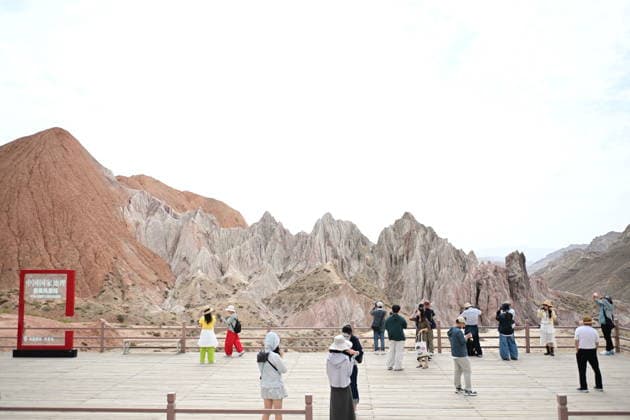 ZHANGYE, CHINA - JULY 06: Tourists visit Alien Valley Geopark on July 6, 2026 in Sunan Yugur Autonomous County, Zhangye City, Gansu Province of China. The scenic area features natural landscapes that resemble the surface of an alien planet.  Copyright: xChinaxNewsxServicex 111652657249