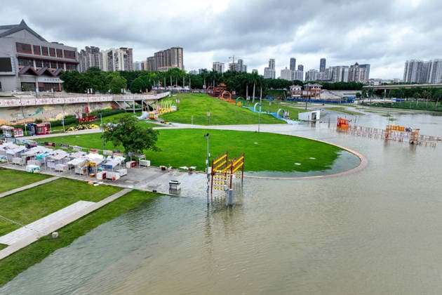 NANNING, CHINA - JULY 06: Aerial view of shops and a parking lot submerged in flood water on July 6, 2026 in Nanning, Guangxi Zhuang Autonomous Region of China. Local authorities launched a Level-IV flood emergency response as the river exceeded warning levels following heavy rainfall brought by typhoon Maysak.  Copyright: xChinaxNewsxServicex 111652650792