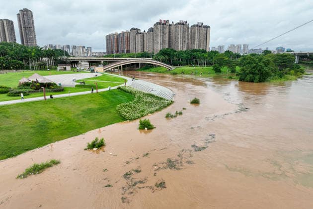 NANNING, CHINA - JULY 06: Aerial view of riverside walkways submerged in flood water on July 6, 2026 in Nanning, Guangxi Zhuang Autonomous Region of China. Local authorities launched a Level-IV flood emergency response as the river exceeded warning levels following heavy rainfall brought by typhoon Maysak.  Copyright: xChinaxNewsxServicex 111652650799