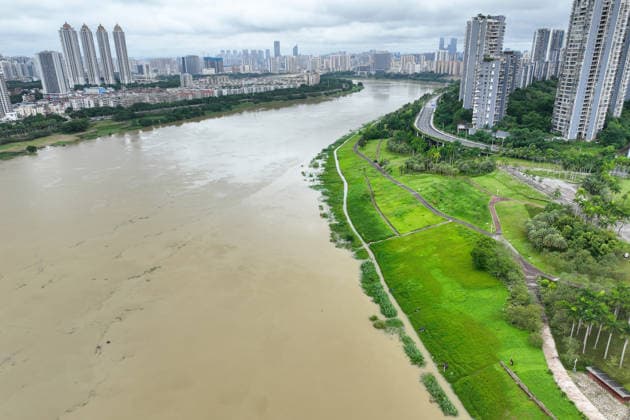 NANNING, CHINA - JULY 06: Aerial view of riverside walkways submerged in flood water on July 6, 2026 in Nanning, Guangxi Zhuang Autonomous Region of China. Local authorities launched a Level-IV flood emergency response as the river exceeded warning levels following heavy rainfall brought by typhoon Maysak.  Copyright: xChinaxNewsxServicex 111652650804