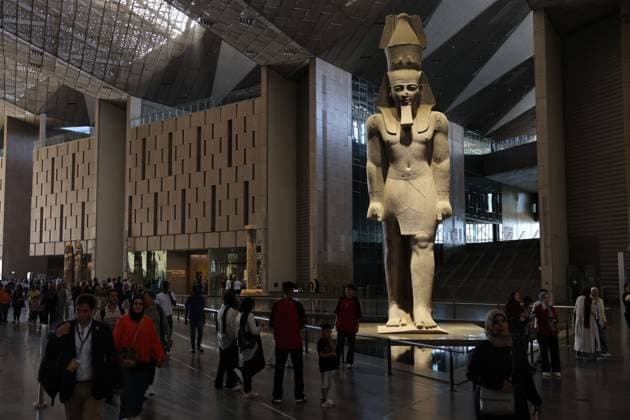 People walk past a statue of King Ramses II at the entrance of the Grand Egyptian Museum (GEM), in Giza, Egypt Cairo, Egypt July 6, 2026: The colossal statue of King Ramesses II dominates the Grand Hall of the Grand Egyptian Museum (GEM), welcoming visitors at the museum s main entrance. Standing approximately 11 meters tall and weighing around 83 tons, the red granite masterpiece dates back more than 3,200 years to Egypt s 19th Dynasty. Originally discovered in the ancient city of Memphis, the statue symbolizes the power and legacy of one of ancient Egypt s greatest pharaohs. Today, it serves as one of the Grand Egyptian Museum s most iconic landmarks, reflecting the grandeur of Egypt s rich archaeological Mahmoud Ghany Giza Egypt Copyright: x xMahmoudxAhmedxabdxelghanyx xJNAxPressx