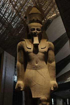 People walk past a statue of King Ramses II at the entrance of the Grand Egyptian Museum (GEM), in Giza, Egypt Cairo, Egypt July 6, 2026: The colossal statue of King Ramesses II dominates the Grand Hall of the Grand Egyptian Museum (GEM), welcoming visitors at the museum s main entrance. Standing approximately 11 meters tall and weighing around 83 tons, the red granite masterpiece dates back more than 3,200 years to Egypt s 19th Dynasty. Originally discovered in the ancient city of Memphis, the statue symbolizes the power and legacy of one of ancient Egypt s greatest pharaohs. Today, it serves as one of the Grand Egyptian Museum s most iconic landmarks, reflecting the grandeur of Egypt s rich archaeological Mahmoud Ghany Giza Egypt Copyright: x xMahmoudxAhmedxabdxelghanyx xJNAxPressx