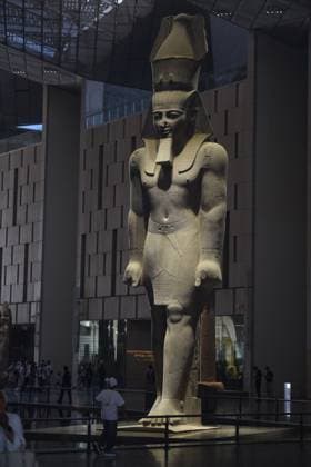 People walk past a statue of King Ramses II at the entrance of the Grand Egyptian Museum (GEM), in Giza, Egypt Cairo, Egypt July 6, 2026: The colossal statue of King Ramesses II dominates the Grand Hall of the Grand Egyptian Museum (GEM), welcoming visitors at the museum s main entrance. Standing approximately 11 meters tall and weighing around 83 tons, the red granite masterpiece dates back more than 3,200 years to Egypt s 19th Dynasty. Originally discovered in the ancient city of Memphis, the statue symbolizes the power and legacy of one of ancient Egypt s greatest pharaohs. Today, it serves as one of the Grand Egyptian Museum s most iconic landmarks, reflecting the grandeur of Egypt s rich archaeological Mahmoud Ghany Giza Egypt Copyright: x xMahmoudxAhmedxabdxelghanyx xJNAxPressx