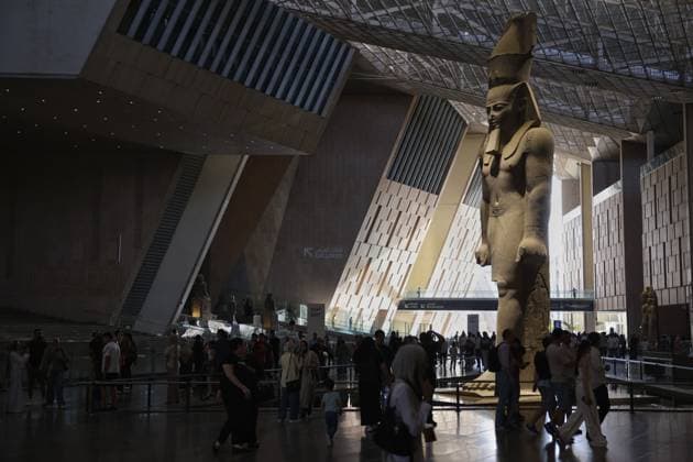 People walk past a statue of King Ramses II at the entrance of the Grand Egyptian Museum (GEM), in Giza, Egypt Cairo, Egypt July 6, 2026: The colossal statue of King Ramesses II dominates the Grand Hall of the Grand Egyptian Museum (GEM), welcoming visitors at the museum s main entrance. Standing approximately 11 meters tall and weighing around 83 tons, the red granite masterpiece dates back more than 3,200 years to Egypt s 19th Dynasty. Originally discovered in the ancient city of Memphis, the statue symbolizes the power and legacy of one of ancient Egypt s greatest pharaohs. Today, it serves as one of the Grand Egyptian Museum s most iconic landmarks, reflecting the grandeur of Egypt s rich archaeological Mahmoud Ghany Giza Egypt Copyright: x xMahmoudxAhmedxabdxelghanyx xJNAxPressx