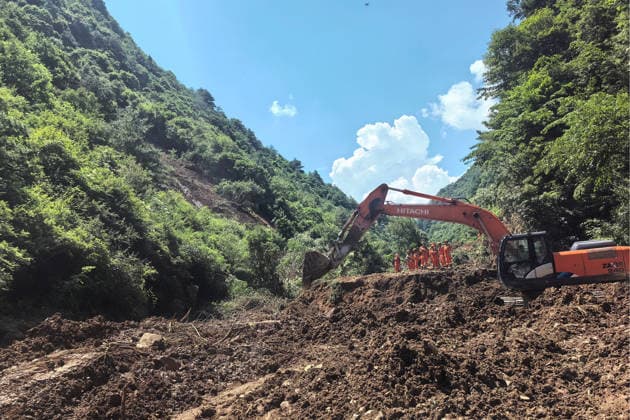 (260707) -- TANCHANG, July 7, 2026 -- Rescuers work at the site of a landslide that took place at a village in Nanhe township of Tanchang County, Longnan City, northwest China s Gansu Province, July 7, 2026. A landslide struck a township in Tanchang County early on Tuesday morning, leaving multiple people missing. The landslide occurred at a village in Nanhe township at around 6:56 a.m., according to local authorities. A total of 33 people are believed to be buried, and 17 of them have been rescued. All-out search and rescue operations are underway. (SpotNews)CHINA-GANSU-TANCHANG-LANDSLIDE-RESCUE (CN) ChenxBin 