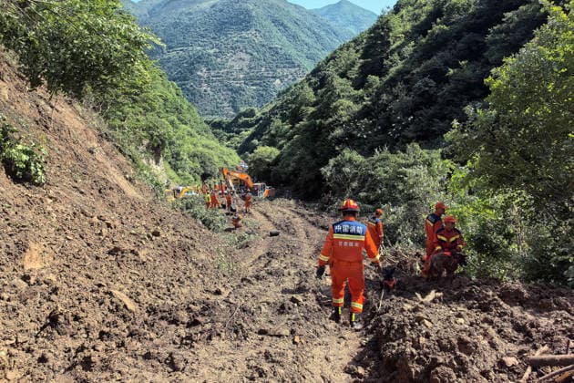 (260707) -- TANCHANG, July 7, 2026 -- Rescuers work at the site of a landslide that took place at a village in Nanhe township of Tanchang County, Longnan City, northwest China s Gansu Province, July 7, 2026. A landslide struck a township in Tanchang County early on Tuesday morning, leaving multiple people missing. The landslide occurred at a village in Nanhe township at around 6:56 a.m., according to local authorities. A total of 33 people are believed to be buried, and 17 of them have been rescued. All-out search and rescue operations are underway. (SpotNews)CHINA-GANSU-TANCHANG-LANDSLIDE-RESCUE (CN) LiuxHui 