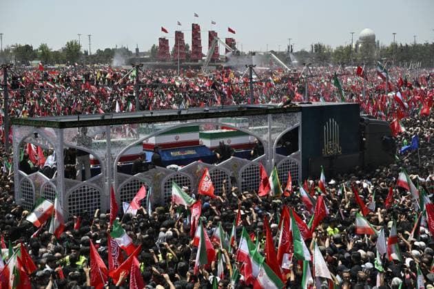 Funeral for Iran s ex-leader Khamenei A truck carrying late Iranian Supreme Leader Ayatollah Ali Khamenei s coffin crawls through crowds in a funeral procession in Tehran, Iran, on July 6, 2026, following his death in Israeli and U.S. airstrikes in February.  A14AA0005621924P