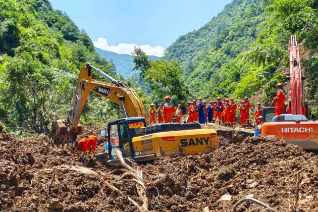 (260707) -- TANCHANG, July 7, 2026 -- Rescuers work at the site of a landslide that took place at a village in Nanhe township of Tanchang County, Longnan City, northwest China s Gansu Province, July 7, 2026. A landslide struck a township in Tanchang County, Longnan City, northwest China s Gansu Province, early on Tuesday morning, leaving multiple people missing. The landslide occurred at a village in Nanhe township at around 6:56 a.m., according to local authorities. A total of 33 people are believed to be buried, and 17 of them have been rescued. All-out search and rescue operations are underway. (SpotNews)CHINA-GANSU-TANCHANG-LANDSLIDE-RESCUE (CN) ChenxBin 