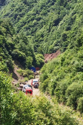(260707) -- TANCHANG, July 7, 2026 -- Rescuers work at the site of a landslide that took place at a village in Nanhe township of Tanchang County, Longnan City, northwest China s Gansu Province, July 7, 2026. A landslide struck a township in Tanchang County, Longnan City, northwest China s Gansu Province, early on Tuesday morning, leaving multiple people missing. The landslide occurred at a village in Nanhe township at around 6:56 a.m., according to local authorities. A total of 33 people are believed to be buried, and 17 of them have been rescued. All-out search and rescue operations are underway. (SpotNews)CHINA-GANSU-TANCHANG-LANDSLIDE-RESCUE (CN) ChenxBin 
