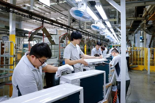 QINGDAO, CHINA - JULY 03: Workers produce air conditioners to fulfill domestic and international orders at the Haier Jiaozhou Air Conditioning Interconnection Factory on July 3, 2026 in Qingdao, Shandong Province of China.  Copyright: xVCGx 111652611978