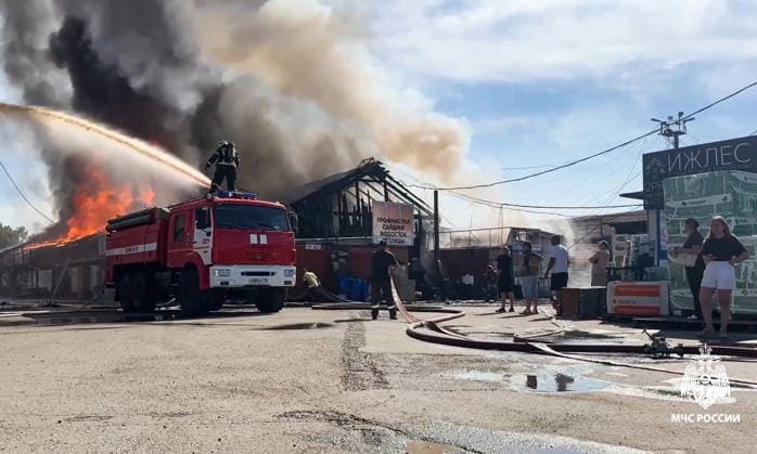 RUSSIA, IZHEVSK - JULY 7, 2026: Firefighters battle a fire at a warehouse distribution center. Video grab. Best quality available. Russia Emergencies Ministry TASS  94776619