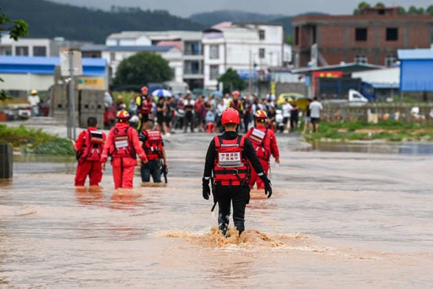 (260707) -- HENGZHOU, July 7, 2026 -- Rescuers wade through floodwaters during rescue operations in Hengzhou of Nanning City, south China s Guangxi Zhuang Autonomous Region, July 6, 2026. Record-breaking rainfall and the ensuing floods in parts of Nanning, capital city of south China s Guangxi Zhuang Autonomous Region, have left four people dead and eight others missing as of 10 a.m. Tuesday, according to a press conference on flood prevention and disaster relief held in Nanning. Hengzhou City and Binyang County, both currently under the jurisdiction of Nanning, recently experienced rainfall that broke local 24-hour meteorological records. The reported casualties were all in Hengzhou. ) CHINA-GUANGXI-NANNING-FLOOD-RESCUE (CN) CaoxYiming 