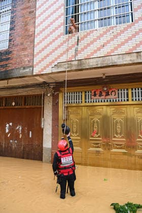 (260707) -- HENGZHOU, July 7, 2026 -- A rescuer delivers relief supplies to stranded residents in Hengzhou of Nanning City, south China s Guangxi Zhuang Autonomous Region, July 6, 2026. Record-breaking rainfall and the ensuing floods in parts of Nanning, capital city of south China s Guangxi Zhuang Autonomous Region, have left four people dead and eight others missing as of 10 a.m. Tuesday, according to a press conference on flood prevention and disaster relief held in Nanning. Hengzhou City and Binyang County, both currently under the jurisdiction of Nanning, recently experienced rainfall that broke local 24-hour meteorological records. The reported casualties were all in Hengzhou. ) CHINA-GUANGXI-NANNING-FLOOD-RESCUE (CN) CaoxYiming 