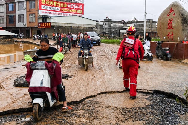 (260707) -- HENGZHOU, July 7, 2026 -- A rescuer is seen during rescue operations in Hengzhou of Nanning City, south China s Guangxi Zhuang Autonomous Region, July 6, 2026. Record-breaking rainfall and the ensuing floods in parts of Nanning, capital city of south China s Guangxi Zhuang Autonomous Region, have left four people dead and eight others missing as of 10 a.m. Tuesday, according to a press conference on flood prevention and disaster relief held in Nanning. Hengzhou City and Binyang County, both currently under the jurisdiction of Nanning, recently experienced rainfall that broke local 24-hour meteorological records. The reported casualties were all in Hengzhou. ) CHINA-GUANGXI-NANNING-FLOOD-RESCUE (CN) CaoxYiming 
