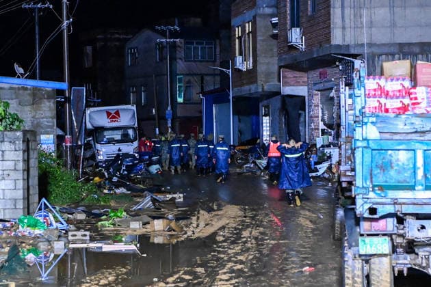 (260707) -- HENGZHOU, July 7, 2026 -- Rescuers are seen in Hengzhou of Nanning City, south China s Guangxi Zhuang Autonomous Region, July 7, 2026. Record-breaking rainfall and the ensuing floods in parts of Nanning, capital city of south China s Guangxi Zhuang Autonomous Region, have left four people dead and eight others missing as of 10 a.m. Tuesday, according to a press conference on flood prevention and disaster relief held in Nanning. Hengzhou City and Binyang County, both currently under the jurisdiction of Nanning, recently experienced rainfall that broke local 24-hour meteorological records. The reported casualties were all in Hengzhou. ) CHINA-GUANGXI-NANNING-FLOOD-RESCUE (CN) CaoxYiming 