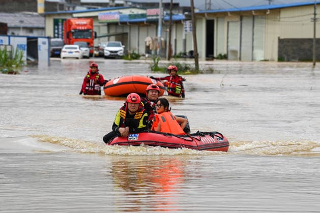 (260707) -- HENGZHOU, July 7, 2026 -- Rescuers evacuate stranded residents in Hengzhou of Nanning City, south China s Guangxi Zhuang Autonomous Region, July 6, 2026. Record-breaking rainfall and the ensuing floods in parts of Nanning, capital city of south China s Guangxi Zhuang Autonomous Region, have left four people dead and eight others missing as of 10 a.m. Tuesday, according to a press conference on flood prevention and disaster relief held in Nanning. Hengzhou City and Binyang County, both currently under the jurisdiction of Nanning, recently experienced rainfall that broke local 24-hour meteorological records. The reported casualties were all in Hengzhou. ) CHINA-GUANGXI-NANNING-FLOOD-RESCUE (CN) CaoxYiming 