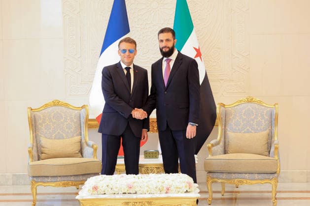 President Macron with President al-Sharaa Meeting - Damascus France s President Emmanuel Macron (L) shakes hands with Syrian President Ahmed al-Sharaa ahead of their meeting at the People s Palace in Damascus on July 7, 2026. French President Emmanuel Macron arrived in Damascus on July 6, 2026 for the first visit by a Western European head of state since Syria s new authorities took power in 2024, an AFP journalist said. Macron, who will depart on July 7, 2026, will advocate for a free, pluralist Syria that respects each of its components and plays a role in moderating Middle East tensions, the French presidency told journalists ahead of his arrival. (hoto by Ludovic Marin Pool ABACAPRESS.COM Damascus Syria  Copyright: xMarinxLudovic Pool ABACAx