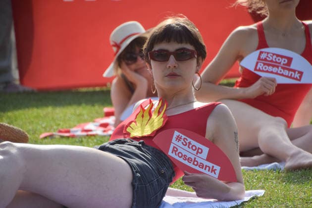July 7, 2026, London, England, United Kingdom: Climate activists from the group Fossil Free London don swimming costumes and stage a Ã¢â‚¬Ëœsunbathe-inÃ¢â‚¬â ¢ protest dubbed Roast Against Rosebank in Parliament Square calling on the government to stop new North Sea oil and gas projects, as another heatwave hits the UK. London United Kingdom  - ZUMAv130 20260707_zip_v130_009 Copyright: xVukxValcicx