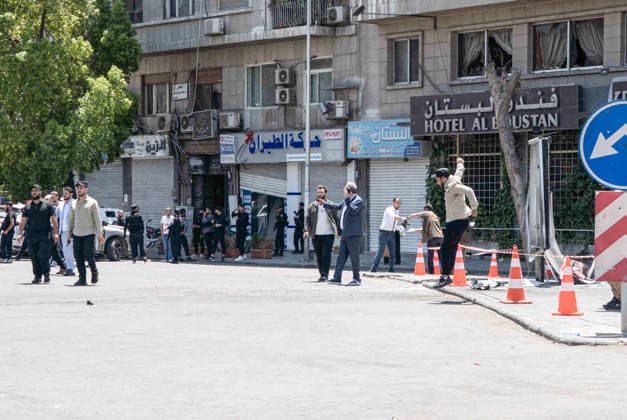 Eighteen injured in double explosions near Tourism Ministry in Syrian capital Damascus DAMASCUS, SYRIA - JULY 7: Security forces take strict security measures following two consecutive explosions that occurred near the Ministry of Tourism building, injuring 18 people including four security personnel, in Damascus, Syria on July 7, 2026. The area was cordoned off as emergency teams and security units responded to the aftermath of the twin blasts in the capital. Anagha Subhash Nair Anadolu Damascus Syria. Editorial use only. Please get in touch for any other usage.  Copyright: x2026xAnadoluxAnaghaxSubhashxNairx