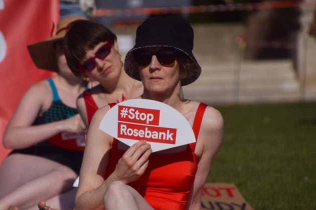 July 7, 2026, London, England, United Kingdom: Climate activists from the group Fossil Free London don swimming costumes and stage a Ã¢â‚¬Ëœsunbathe-inÃ¢â‚¬â ¢ protest dubbed Roast Against Rosebank in Parliament Square calling on the government to stop new North Sea oil and gas projects, as another heatwave hits the UK. London United Kingdom  - ZUMAv130 20260707_zip_v130_021 Copyright: xVukxValcicx