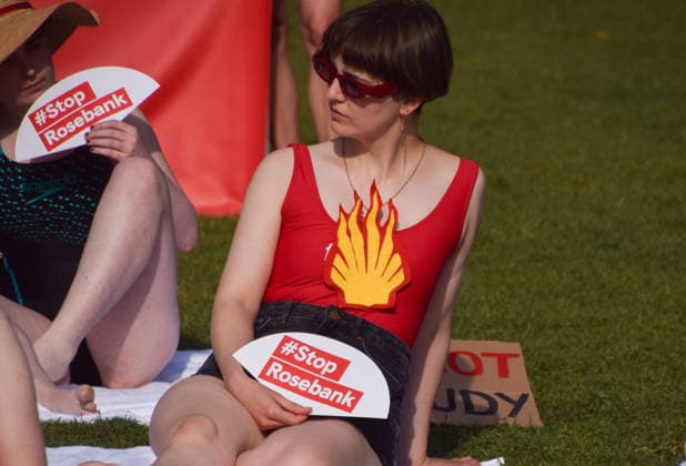 July 7, 2026, London, England, United Kingdom: Climate activists from the group Fossil Free London don swimming costumes and stage a Ã¢â‚¬Ëœsunbathe-inÃ¢â‚¬â ¢ protest dubbed Roast Against Rosebank in Parliament Square calling on the government to stop new North Sea oil and gas projects, as another heatwave hits the UK. London United Kingdom - ZUMAv130 20260707_zip_v130_024 Copyright: xVukxValcicx