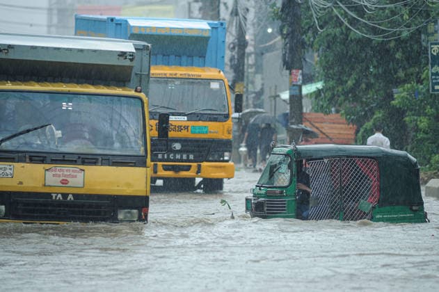 July 7, 2026: Chattogram, Bangladesh - A Cng strucked in a waterlogged street in the Bahaddarhat area of Chattogram on Tuesday, continuing three consecutive days of heavy rainfall. The persistent downpours triggered severe waterlogging across several parts of the port city, submerging roads, disrupting traffic, and causing widespread inconvenience to residents. - ZUMAr143 20260707_zap_r143_022 Copyright: xMdxRafayatxHaquexKhanx
