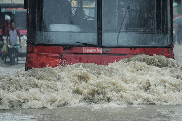 July 7, 2026: Chattogram, Bangladesh - A commuter bus navigate a waterlogged street in the Bahaddarhat area of Chattogram on Tuesday, continuing three consecutive days of heavy rainfall. The persistent downpours triggered severe waterlogging across several parts of the port city, submerging roads, disrupting traffic, and causing widespread inconvenience to residents. - ZUMAr143 20260707_zap_r143_024 Copyright: xMdxRafayatxHaquexKhanx