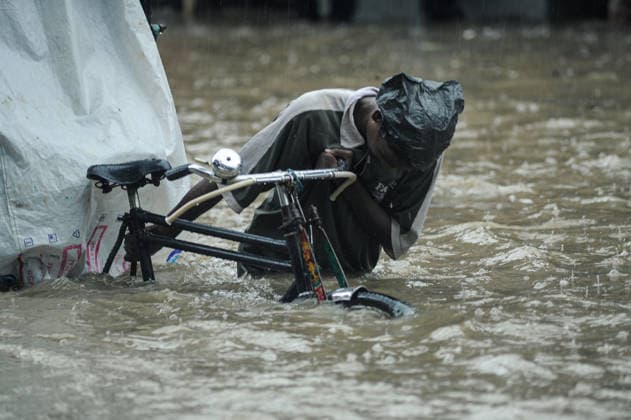 July 7, 2026: Chattogram, Bangladesh - A Rickshaw pullers navigate a waterlogged street in the Bahaddarhat area of Chattogram on Tuesday, continuing three consecutive days of heavy rainfall. The persistent downpours triggered severe waterlogging across several parts of the port city, submerging roads, disrupting traffic, and causing widespread inconvenience to residents. - ZUMAr143 20260707_zap_r143_032 Copyright: xMdxRafayatxHaquexKhanx