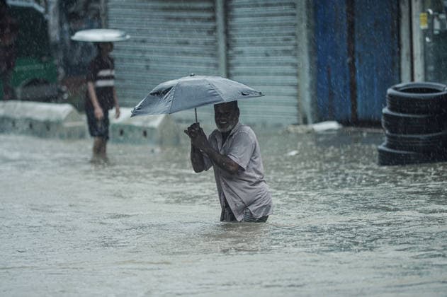 July 7, 2026: Chattogram, Bangladesh - Pedestrian navigate a waterlogged street in the Bahaddarhat area of Chattogram on Tuesday, continuing three consecutive days of heavy rainfall. The persistent downpours triggered severe waterlogging across several parts of the port city, submerging roads, disrupting traffic, and causing widespread inconvenience to residents. - ZUMAr143 20260707_zap_r143_033 Copyright: xMdxRafayatxHaquexKhanx