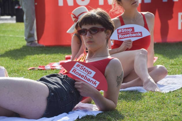 July 7, 2026, London, England, United Kingdom: Climate activists from the group Fossil Free London don swimming costumes and stage a Ã¢â‚¬Ëœsunbathe-inÃ¢â‚¬â ¢ protest dubbed Roast Against Rosebank in Parliament Square calling on the government to stop new North Sea oil and gas projects, as another heatwave hits the UK. London United Kingdom  - ZUMAv130 20260707_zip_v130_029 Copyright: xVukxValcicx