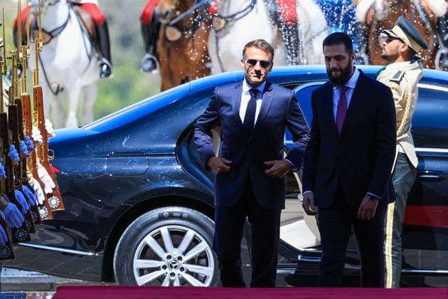 President Macron with President al-Sharaa Meeting - Damascus France s President Emmanuel Macron (L) and Syria s President Ahmed al-Sharaa arrive ahead of their meeting at the People s Palace in Damascus on July 7, 2026. Syria s President Ahmed al-Sharaa hailed France s constructive role in the transition since the toppling of longtime ruler Bashar al-Assad, as French leader Emmanuel Macron made the first post-conflict visit to Damascus by a Western European leader. Photo by Ludovic Marin Pool ABACAPRESS.COM Damascus Syria  Copyright: xMarinxLudovic Pool ABACAx