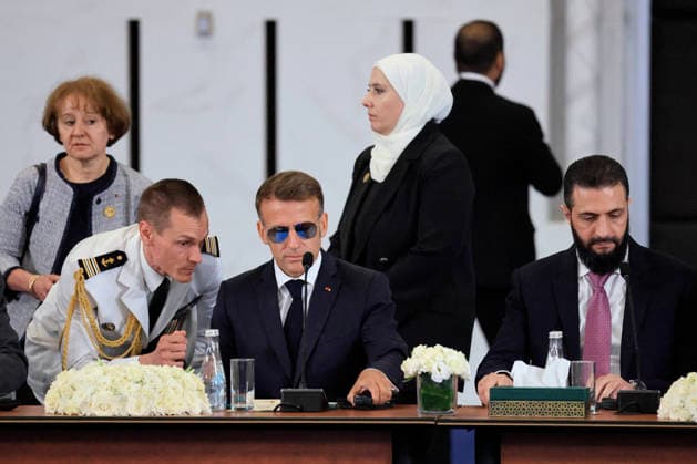 President Macron Visits Syria - Economic Forum France s President Emmanuel Macron (C) and Syria s President Ahmed al-Sharaa (R) take part in the Economic forum focusing on the reconstruction of Syria and strategic corridors, in Damascus on July 7, 2026. Syria s President Ahmed al-Sharaa hailed France s constructive role in the transition since the toppling of longtime ruler Bashar al-Assad, as French leader Emmanuel Macron made the first post-conflict visit to Damascus by a Western European leader. Photo by Ludovic Marin Pool ABACAPRESS.COM Damascus Syria  Copyright: xMarinxLudovic Pool ABACAx