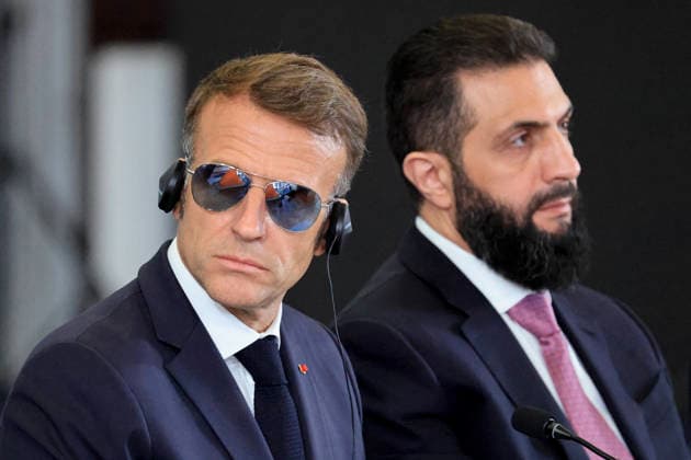President Macron Visits Syria - Economic Forum France s President Emmanuel Macron (L) listens to translation flanked by Syria s President Ahmed al-Sharaa as he takes part in the Economic forum focusing on the reconstruction of Syria and strategic corridors, in Damascus on July 7, 2026. Syria s President Ahmed al-Sharaa hailed France s constructive role in the transition since the toppling of longtime ruler Bashar al-Assad, as French leader Emmanuel Macron made the first post-conflict visit to Damascus by a Western European leader. Photo by Ludovic Marin Pool ABACAPRESS.COM Damascus Syria  Copyright: xMarinxLudovic Pool ABACAx