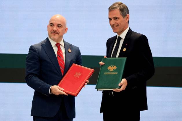 President Macron Visits Syria - Economic Forum Chief Executive Officer of Syrian Airlines Anwar Al-Akkad (L) and CMA CGM Group Chairman and CEO Rodolphe Saade pose holding the Memorandum of Understanding on the handling of air freight at Damascus International Airport during an agreement signing ceremony in Damascus on July 7, 2026.. French President Emmanuel Macron arrived in Damascus on July 6, 2026 for the first visit by a Western European head of state since Syria s new authorities took power in 2024, an AFP journalist said. Macron, who will depart on July 7, 2026, will advocate for a free, pluralist Syria that respects each of its components and plays a role in moderating Middle East tensions, the French presidency told journalists a  Copyright: xMarinxLudovic Pool ABACAx