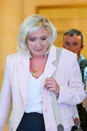 Marine Le Pen, president of the National Rally, leaves the Paris Court of Appeals, France, on July 7, 2026, following the verdict in the appeal trial of former and current RN members accused of embezzling European public funds in a case involving the creation of fictitious jobs at the European Parliament. The Court of Appeals sentenced Marine Le Pen, leader of the French far right, to one year of house arrest with an electronic ankle monitor for this case, thereby jeopardizing her presidential candidacy next April. She was also barred from running for office for 15 months, a ban that was set to expire this year. Christian Liewig Bestimage President of the Rassemblement National parliamentary group Marine Le Pen leaves after the verdict in  Copyright: xChristianxLiewigx xBestimagexChristianxLiewigx xBestimagex