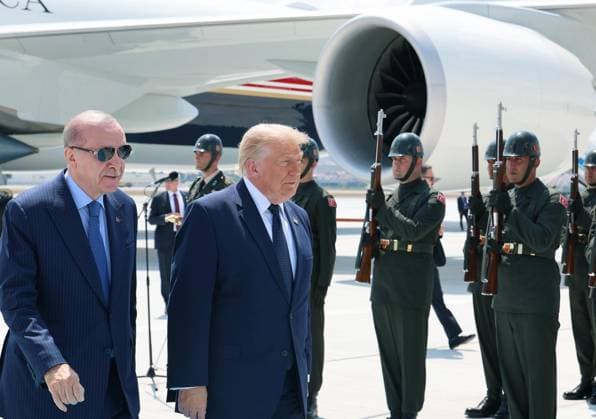 US President Donald Trump is greeted by Turkish President Recep Tayyip Erdogan, left, upon arriving for the NATO summit in Ankara, Turkey, Tuesday, July 7, 2026. (Turkish Presidency Pool - Depo Photos) 19155681