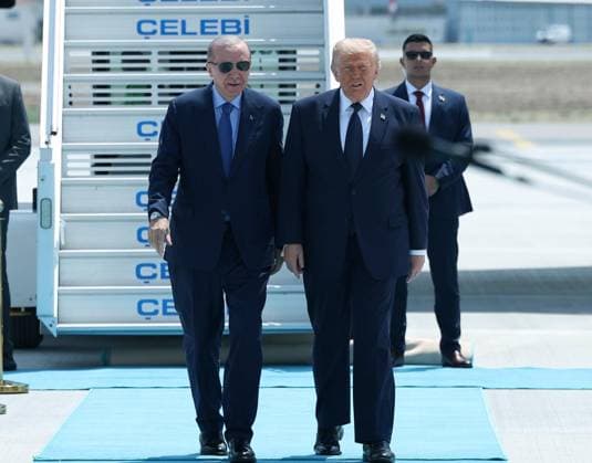 US President Donald Trump is greeted by Turkish President Recep Tayyip Erdogan, left, upon arriving for the NATO summit in Ankara, Turkey, Tuesday, July 7, 2026. (Turkish Presidency Pool - Depo Photos) 19155682