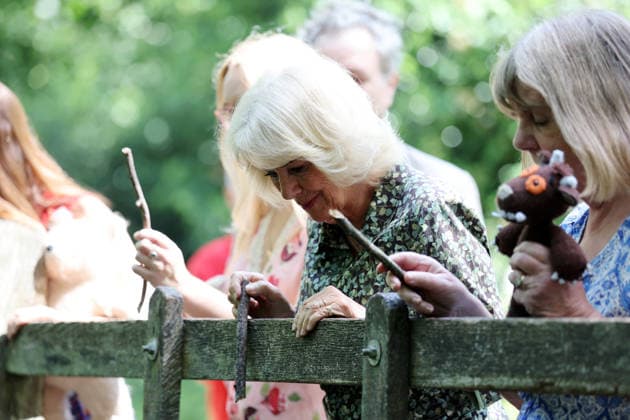 Queen Camilla Commemorates 100 Years Of Winnie The Pooh in Hartfield, UK, 07 July 2026 HARTFIELD, ENGLAND - JULY 07: Queen Camilla plays a game of ˜pooh sticks™ on ˜Poohsticks Bridge™ during her visit to Ashdown Forest to commemorate 100 Years of Winnie-the-Pooh at Ashdown Forest on July 07, 2026 in Hartfield, England. Ashdown Forest was the inspiration for the Hundred Acre Wood in A.A. Milne s classic Winnie-the-Pooh children s books. The Queen visited the forest in her role as patron of the Royal Literary Fund., Credit:Chris Jackson PA ROTA - B68 Avalon Hartfield, United Kingdom  Copyright: xChrisxJacksonx xPAxROTAx-xB68x xAvalonx 1115017889