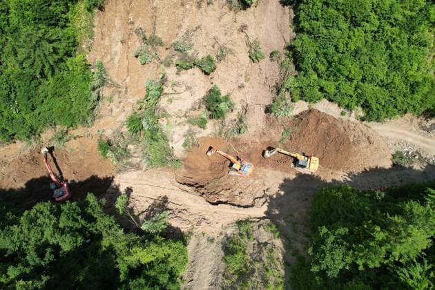 (260707) -- TANCHANG, July 7, 2026 -- An aerial drone photo taken on July 7, 2026 shows rescuers working at the site of a landslide in a village in Nanhe Township, Tanchang County, Longnan City, northwest China s Gansu Province. China s Ministry of Emergency Management activated a Level-IV national emergency response for geological disasters in northwest China s Gansu Province and dispatched a working team to guide rescue and relief efforts after a landslide struck a village on Tuesday, leaving multiple people buried and dead. The landslide occurred at around 6:56 a.m. in a village in Nanhe Township, Tanchang County, Longnan City, according to local authorities. A total of 33 people were buried beneath the debris. As of 2:50 p.m., 