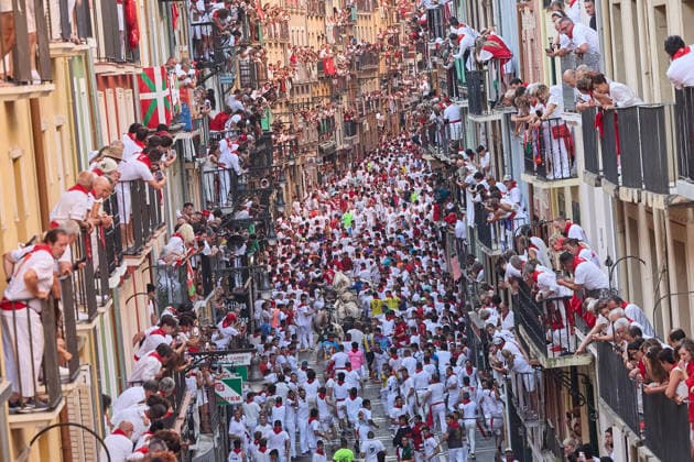 July 7, 2026, Pamplona, Navarre, Spain: People take part in the traditional encierro (bull-run) of the San Fermin Festival in Pamplona, Spain. The bull-running fiesta is held annually from 06 to 14 July in commemoration of the city s patron saint. Visitors from all over the world attend the festival. Many of them physically participate in the highlight event - the running of the bulls, or encierro - where they attempt to outrun the animals along a route through the narrow streets of Pamplona s old city. Pamplona Spain  - ZUMAa206 20260707_zsp_a206_005 Copyright: xRubenxAlbarranx