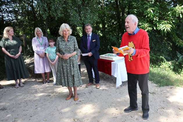 . 07 07 2026. Ashdown Forest. United Kingdom. Queen Camilla and Gyles Brandreth during a visit to Ashdown Forest, United Kingdom , to commemorate 100 years of Winnie-the-Pooh . During the visit she played a game of pooh sticks on pooh sticks bridge with children .  xPoolx xi-Imagesx IIM-26893-0026