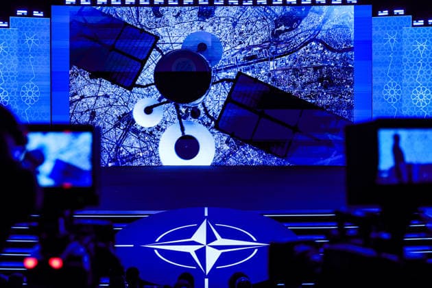 July 7, 2026, Ankara, Turkiye, Turkiye: An image of a satellite over a city is projected on screen above the NATO logo during the Space and Surveillance segment of the NATO Summit Defence Industry Forum in Ankara. As technology develops rapidly and space activity accelerates, questions around access, security, governance and regulation have become increasingly prominent amid ongoing conflicts. Ankara Turkiye  - ZUMAo116 20260707_znp_o116_003 Copyright: xBiancaxOterox