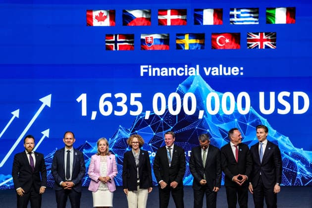 July 7, 2026, Ankara, Turkiye, Turkiye: NATO Deputy Secretary General RADMILA SEKERINSKA (4th L) stands on stage with international defence officials and military commanders in front of a digital screen displaying a total contract value of 1,635,000,000 USD during the Strike Capabilities announcement at the NATO Summit Defence Industry Forum at the ATO Congresium. The multi-billion-dollar framework, representing one of three flagship industrial pillars alongside Space and Surveillance and Integrated Air and Missile Defence, coordinates precision munitions and missile production across an eleven-nation coalition involving defence firms Diehl and Roketsan. Ankara Turkiye  - ZUMAo116 20260707_znp_o116_029 Copyright: xBiancaxOterox