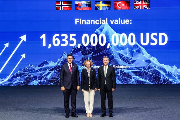 July 7, 2026, Ankara, Turkiye, Turkiye: Roketsan CEO MURAT IKINCI (L), NATO Deputy Secretary General RADMILA SEKERINSKA (C), and President of the Turkish Secretariat of Defence Industries HALUK GORGUN (R) stand together on stage before a digital screen displaying a total contract value of 1,635,000,000 USD during the Strike Capabilities segment of the NATO Summit Defence Industry Forum (NSDIF) at the ATO Congresium. Ankara Turkiye  - ZUMAo116 20260707_znp_o116_030 Copyright: xBiancaxOterox