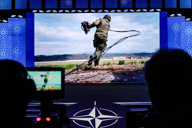 July 7, 2026, Ankara, Turkiye, Turkiye: A view from behind broadcast video cameras shows a dynamic military presentation of a soldier what appears to be him throwing cables projected on the main digital stage screen during the NATO Summit Defence Industry Forum (NSDIF) at the ATO Congresium. Ankara Turkiye - ZUMAo116 20260707_znp_o116_031 Copyright: xBiancaxOterox