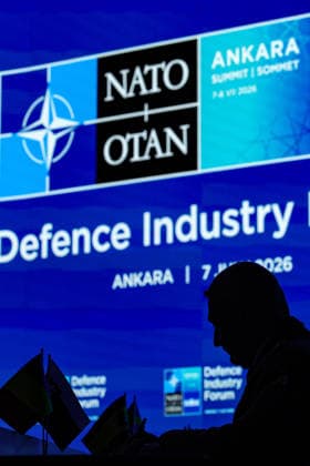 July 7, 2026, Ankara, Turkiye, Turkiye: An allied official is silhouetted while signing an agreement at a desk during a monumental mass signing ceremony before a large digital screen at the NATO Summit Defence Industry Forum at the ATO Congresium. The historic event saw alliance nations and global aerospace executives simultaneously finalise more than 70 billion USD in combined transatlantic defence procurement contracts, establishing major unified frameworks across integrated air defence, counter-drone networks, and precision strike capabilities. Ankara Turkiye - ZUMAo116 20260707_znp_o116_034 Copyright: xBiancaxOterox