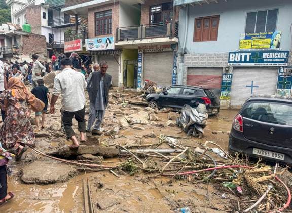 People walk over the debris that lies scattered after flood Doda, Jul 07 (ANI): People walk over the debris that lies scattered after flood, in Doda on Tuesday. Doda Jammu and Kashmir India Copyright: xANIx ANI_20260707321