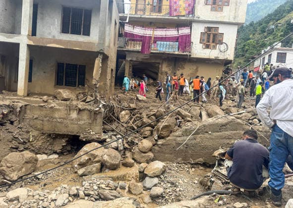 People walk over the debris that lies scattered after flood Doda, Jul 07 (ANI): People walk over the debris that lies scattered after flood, in Doda on Tuesday. Doda Jammu and Kashmir India Copyright: xANIx ANI_20260707324